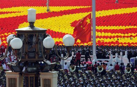 Guards of the national flag raise national flag at the start of the celebrations for the 60th anniversary of the founding of the People's Republic of China, on the Tian'anmen Square in central Beijing, capital of China, Oct. 1, 2009. (Xinhua/Li Xiaoguo)