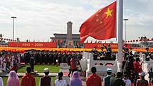 Guards of the national flag hold the national flag-raising ceremony at the start of the celebrations for the 60th anniversary of the founding of the People's Republic of China, on the Tian'anmen Square in central Beijing, capital of China, October 1, 2009.