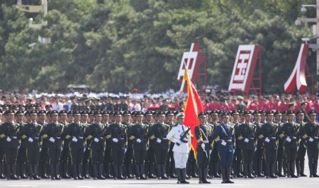 The guard of honor of the three services of the Chinese People's Liberation Army marches at the head of the march-past of a parade in the celebrations for the 60th anniversary of the founding of the People's Republic of China, in central Beijing, capital of China, Oct. 1, 2009. (Xinhua/Liu Dawei)