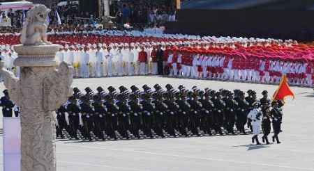 The guard of honor of the three services of the Chinese People's Liberation Army marches at the head of the march-past of a parade in the celebrations for the 60th anniversary of the founding of the People's Republic of China, in central Beijing, capital of China, Oct. 1, 2009. (Xinhua/Liu Dawei)