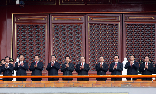 President Hu Jintao (L5), flanked by former president Jiang Zemin (R5), top legislator Wu Bangguo (L4), Premier Wen Jiabao (R4) and other leaders, watches the celebrations for the 60th anniversary of the founding of the People's Republic of China, on the Tian'anmen Rostrum in central Beijing, capital of China, Oct. 1, 2009. (Xinhua Photo)