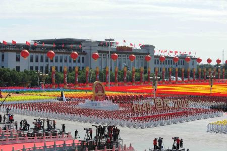 A float carrying the national emblem takes part in a parade of the celebrations for the 60th anniversary of the founding of the People&apos;s Republic of China, on Chang&apos;an Street in central Beijing, capital of China, Oct. 1, 2009. (Xinhua/Guo Dayue)