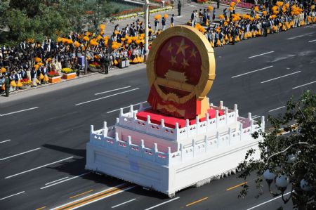 A float of the national emblem takes part in a parade of the celebrations for the 60th anniversary of the founding of the People&apos;s Republic of China, on Chang&apos;an Street in central Beijing, capital of China, Oct. 1, 2009. (Xinhua/Li Yong)