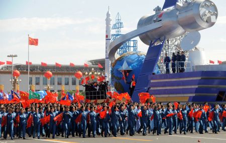 A float depicting a Chinese space ship takes part in a parade of the celebrations for the 60th anniversary of the founding of the People&apos;s Republic of China, on Chang&apos;an Street in central Beijing, capital of China, Oct. 1, 2009. (Xinhua/Xu Yu)