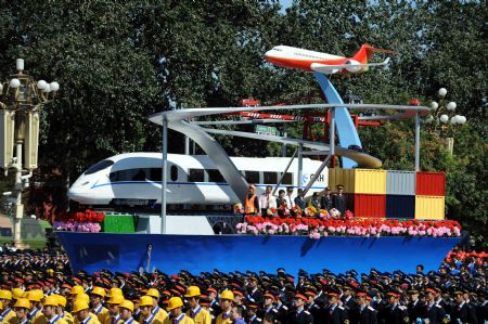 The float expressing transportation takes part in a parade of the celebrations for the 60th anniversary of the founding of the People&apos;s Republic of China, on Chang&apos;an Street in central Beijing, capital of China, Oct. 1, 2009. (Xinhua/Li Gang)