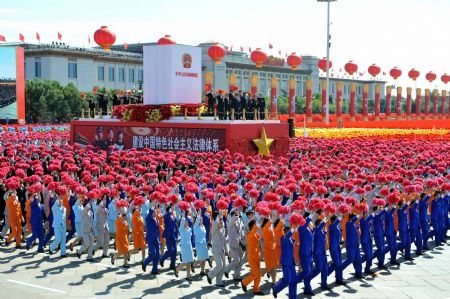 A float takes part in a parade of the celebrations for the 60th anniversary of the founding of the People&apos;s Republic of China, on Chang&apos;an Street in central Beijing, capital of China, Oct. 1, 2009. (Xinhua/Li Xiaoguo)