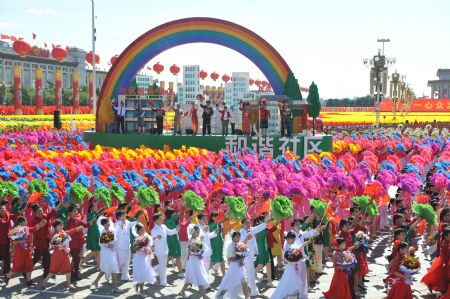 A float featuring "harmonious community" takes part in a parade of the celebrations for the 60th anniversary of the founding of the People