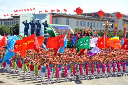 A float of education takes part in a parade of the celebrations for the 60th anniversary of the founding of the People&apos;s Republic of China, on Chang&apos;an Street in central Beijing, capital of China, Oct. 1, 2009. (Xinhua/Li Xiaoguo