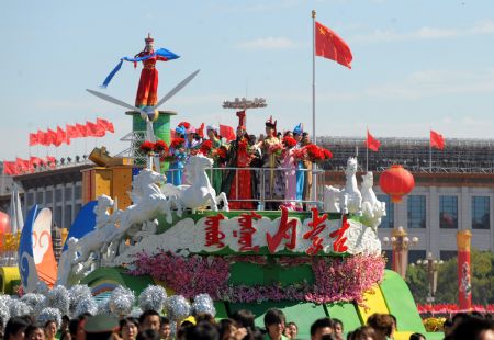 The float of north China&apos;s Inner Mongolia Autonomous Region takes part in a parade of the celebrations for the 60th anniversary of the founding of the People&apos;s Republic of China, on Chang&apos;an Street in central Beijing, capital of China, Oct. 1, 2009. (Xinhua/Xu Yu)