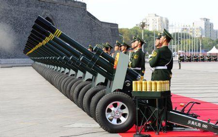 Soldiers of the Chinese People's Armed Police Force fire 60 gun salute at the start of the celebrations for the 60th anniversary of the founding of the People's Republic of China, near the Tian'anmen Square in central Beijing, capital of China, Oct. 1, 2009. (Xinhua/Ren Yong)