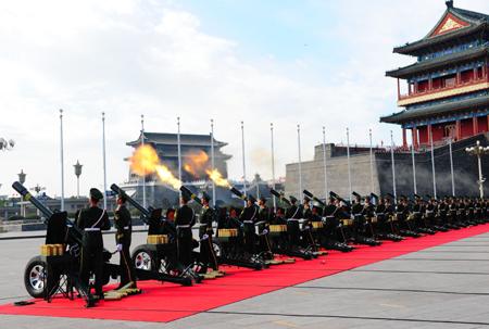 Soldiers of the Chinese People's Armed Police Force fire 60 gun salute at the start of the celebrations for the 60th anniversary of the founding of the People's Republic of China, near the Tian'anmen Square in central Beijing, capital of China, Oct. 1, 2009. (Xinhua/Ren Yong)