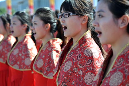 The chorus sings in the celebrations for the 60th anniversary of the founding of the People&apos;s Republic of China, on the Tian&apos;anmen Square in central Beijing, capital of China, Oct. 1, 2009.(Xinhua/Jin Liangkuai)