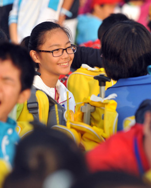 Students take part in the celebrations for the 60th anniversary of the founding of the People&apos;s Republic of China, on the Tian&apos;anmen Square in central Beijing, capital of China, Oct. 1, 2009.(Xinhua/Jin Liangkuai)