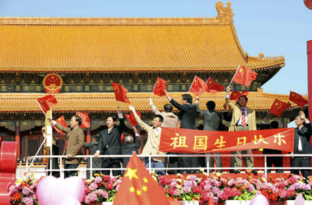 A float takes part in a parade of the celebrations for the 60th anniversary of the founding of the People&apos;s Republic of China, on Chang&apos;an Street in central Beijing, capital of China, Oct. 1, 2009. (Xinhua/Li Tao)