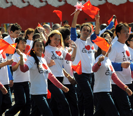 People take part in the celebrations for the 60th anniversary of the founding of the People&apos;s Republic of China, in Beijing, capital of China, Oct. 1, 2009. (Xinhua/Xu Yu)