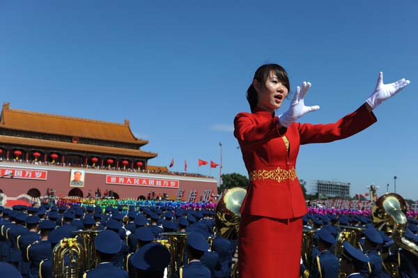 The conductor of a chorus conducts in the celebrations for the 60th anniversary of the founding of the People's Republic of China, on the Tian'anmen Square in central Beijing, capital of China, Oct. 1, 2009.(Xinhua/Jin Liangkuai)
