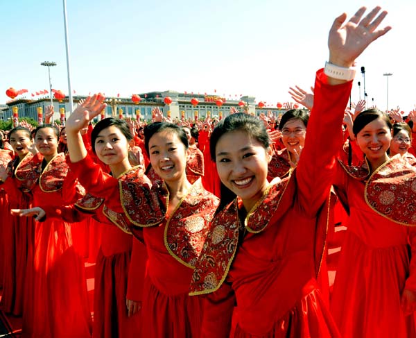 Members of a chorus gesture in the celebrations for the 60th anniversary of the founding of the People's Republic of China, on the Tian'anmen Square in central Beijing, capital of China, Oct. 1, 2009.(Xinhua/Wang Xiaochuan)