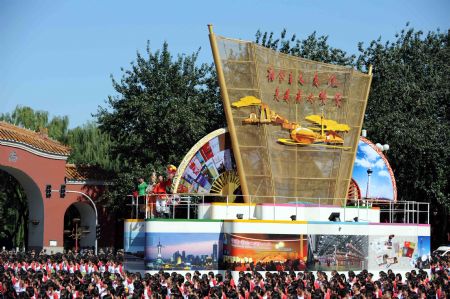 The float expressing "culture flourish" takes part in a parade of the celebrations for the 60th anniversary of the founding of the People