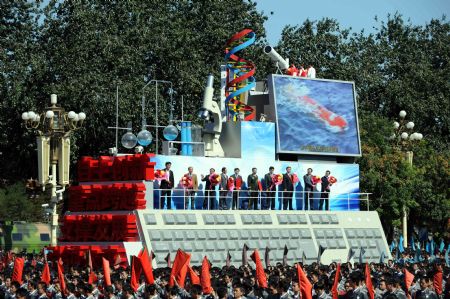 The float expressing "science and technology development" takes part in a parade of the celebrations for the 60th anniversary of the founding of the People