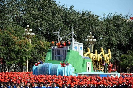 The float expressing "energy sources development" takes part in a parade of the celebrations for the 60th anniversary of the founding of the People