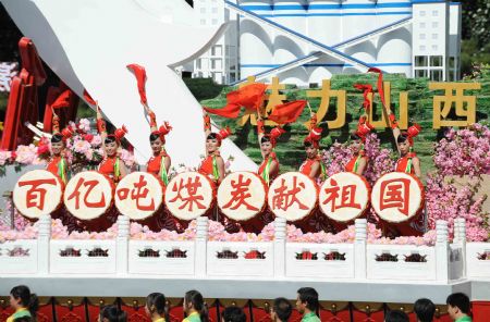 The float of central China&apos;s Shanxi Province, takes part in a parade of the celebrations for the 60th anniversary of the founding of the People&apos;s Republic of China, on Chang&apos;an Street in central Beijing, capital of China, Oct. 1, 2009. (Xinhua/Li Gang)