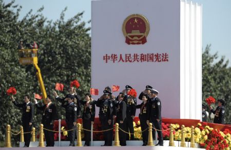 A float takes part in a parade of the celebrations for the 60th anniversary of the founding of the People&apos;s Republic of China, on Chang&apos;an Avenue in central Beijing, capital of China, Oct. 1, 2009. (Xinhua/Liu Dawei)