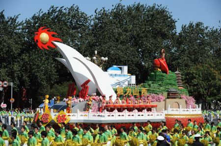 The float of central China&apos;s Shanxi Province, takes part in a parade of the celebrations for the 60th anniversary of the founding of the People&apos;s Republic of China, on Chang&apos;an Street in central Beijing, capital of China, Oct. 1, 2009. (Xinhua/Li Gang)