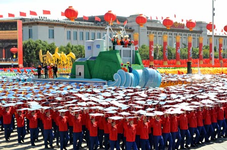 A float featuring "development of energy industry" takes part in a parade of the celebrations for the 60th anniversary of the founding of the People