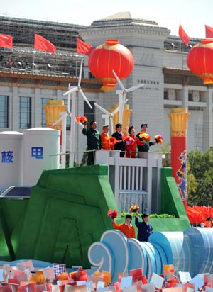 A float featuring "development of energy industry" takes part in a parade of the celebrations for the 60th anniversary of the founding of the People