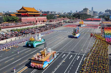 The floats of south China&apos;s Hong Kong Special Administrative Region (HKSAR) (1st front), south China&apos;s Macao Special Administrative Region (2nd front) and southeast China&apos;s Taiwan Province (3rd front) take part in a parade of the celebrations for the 60th anniversary of the founding of the People&apos;s Republic of China, in Beijing, capital of China, Oct. 1, 2009. (Xinhua/Huang Jingwen)