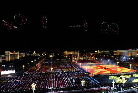 Fireworks depicting smiling faces are seen over the Tian&apos;anmen Square during the grand evening gala celebrating the 60th anniversary of the founding of the People&apos;s Republic of China, in Beijing, capital of China, October 1, 2009.