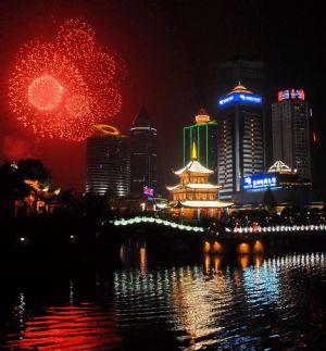 Scintillant firework flare up and flash over an array of edifices and the Jiaxiulou Tower, the city's landmark ancient building for sightseeing, during a grand firework celebration of the 60th anniversary of the founding of the People's Republic of China, in Guiyang, southwest China's Guizhou Province, September 30, 2009. 