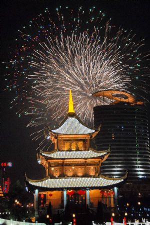 Scintillant firework flare up and flash over the Jiaxiulou Tower, the city's landmark ancient building for sightseeing, during a grand firework celebration of the 60th anniversary of the founding of the People's Republic of China, in Guiyang, southwest China's Guizhou Province, September 30, 2009.