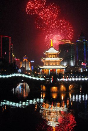 Scintillant firework flare up and flash over the Jiaxiulou Tower, the city's landmark ancient building for sightseeing, during a grand firework celebration of the 60th anniversary of the founding of the People's Republic of China, in Guiyang, southwest China's Guizhou Province, September 30, 2009.