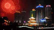Scintillant firework flare up and flash over an array of edifices and the Jiaxiulou Tower, the city's landmark ancient building for sightseeing, during a grand firework celebration of the 60th anniversary of the founding of the People's Republic of China, in Guiyang, southwest China's Guizhou Province, September 30, 2009.
