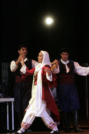 Greek students dance at the opening ceremony for the first Confucius Institute in Greece in Athens, capital of Greece, October 8, 2009.