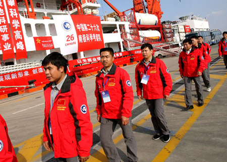 Members of China's 26th Antarctic exploration team prepare to get on board in Shanghai, China, October 10, 2009.