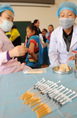 A pupil is injected the vaccine against the A/H1N1 flu in Lhasa, capital of southwest China's Tibet Autonomous Region, Oct. 14, 2009. The health ministry already sent 200,000 doses of flu vaccine to Tibet Autonomous Region. Students of primary and middle schools and children in kindergartens started to be given the vaccines on Wednesday.