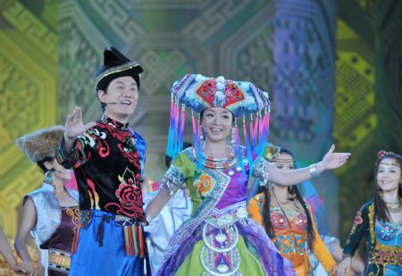 Singers perform at an evening gala marking the open of the 11th Nanning International Folk Song Arts Festival in Nanning, capital of southwest China's Guangxi Zhuang Autonomous Region, October 20, 2009.