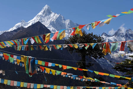 Photo taken on October 24, 2009 shows a snow-capped peak of the Meili Snow Mountain in Deqin county, Diqing Tibetan Autonomous Prefecture, in southwest China's Yunnan Province. 