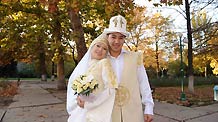 A couple wearing traditional wedding dress pose for wedding photos in Bishkek, capital of Kyrgyzstan, October 29, 2009.