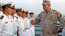 Scott Sanders (R), commander of the US 151 Task Formation Fleet, talks with Chinese soldiers on the Chinese warship of 'Zhongshan' at the Gulf of Aden November 1, 2009.