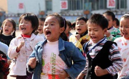 Students take PE class in Shuanghe Elementary School in Huaying, southwest China's Sichuan Province, November 3, 2009.