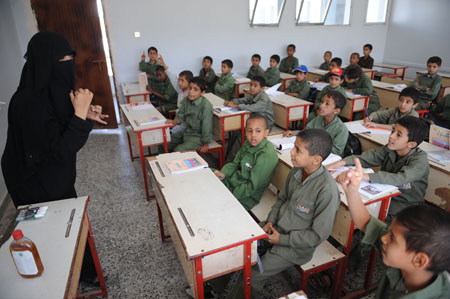 Pupils attend classes at a primary school in Sanaa, capital of Yemen, on November 3, 2009. Most primary and middle schools in Yemen have resumed classes recently after a two-or-three-month closure to prevent the large-scale outbreak of A/H1N1 influenza. 