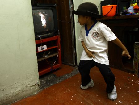 Jose Manuel Sanchez Aguero, a five-year-old boy, imitates Michael Jackson