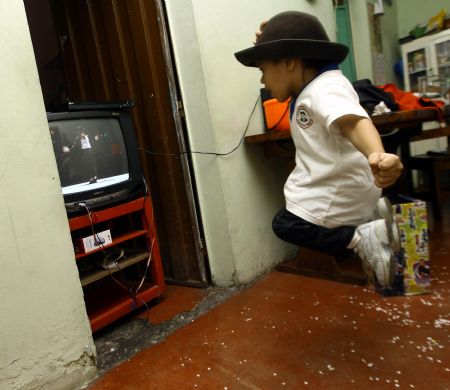 Jose Manuel Sanchez Aguero, a five-year-old boy, imitates Michael Jackson at home in Barquisimeto, Venezuela, Oct. 30, 2009. Jose