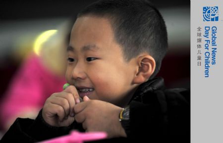 Zhu Xu attends a class in Xianfeng County of Enshi, central China's Hubei Province, October 12, 2009. 