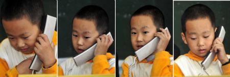 Combo picture taken on October 12, 2009 shows that Zhu Xu talks on telephone with his parents at school in Xianfeng County in Enshi, central China&apos;s Hubei Province.