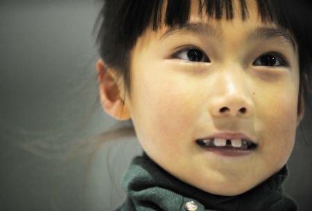 Photo taken on October 30, 2009 shows smiling Zhang Mingyang in Harbin, capital of northeast China's Heilongjiang Province.'I have many dreams before learning skating, such as to be a scientist, a teacher or a doctor in the future. However, there is only one dream left now.