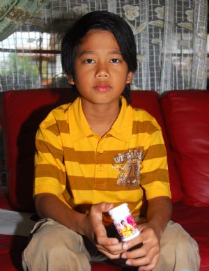 Adi Putra shows a product of his own company at home in Gombak District, Selangor State, Malaysia, on October 7, 2009. 